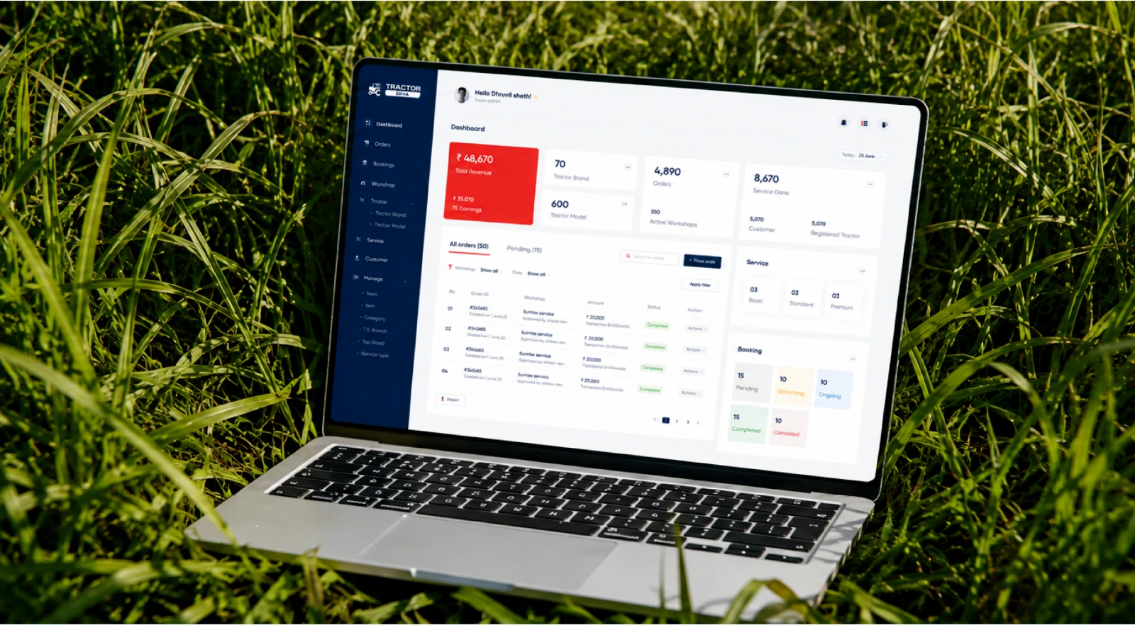 The Tractor Seva service dashboard open on a laptop standing in a field of long grass.